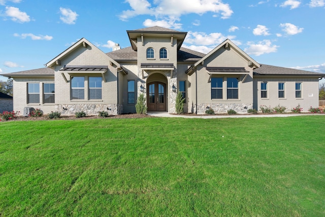 view of front of property with french doors and a front yard