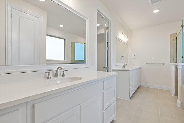 bathroom featuring tile patterned floors, vanity, and an enclosed shower