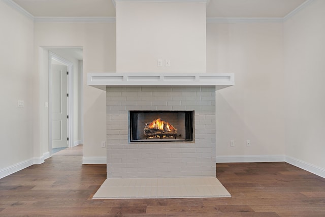 details featuring a fireplace, hardwood / wood-style flooring, and ornamental molding