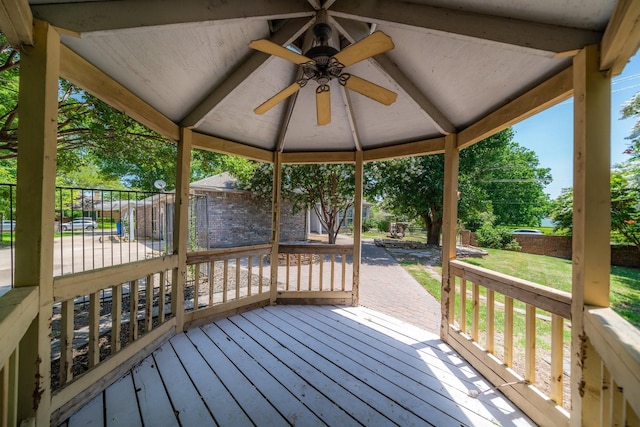 wooden deck featuring a gazebo and ceiling fan