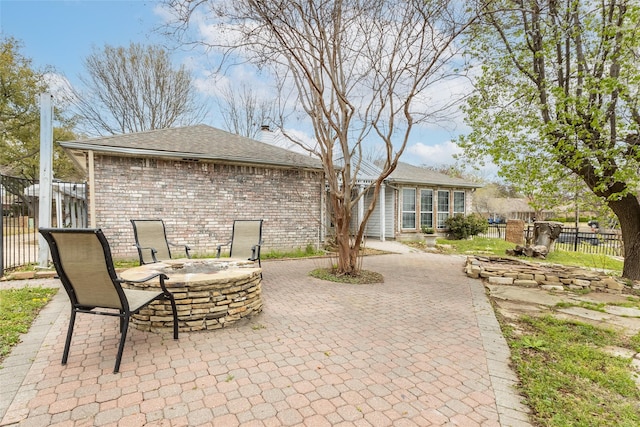 view of patio with a fire pit