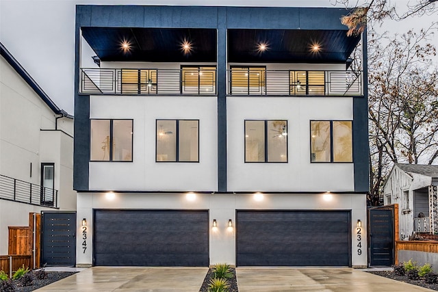 contemporary home with a balcony and a garage