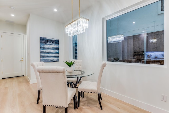 dining area with hardwood / wood-style flooring