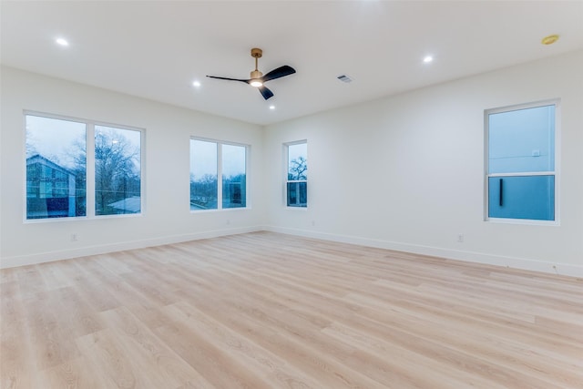 spare room featuring ceiling fan and light wood-type flooring