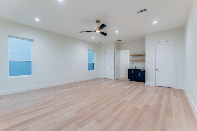 unfurnished bedroom featuring light hardwood / wood-style flooring and ceiling fan