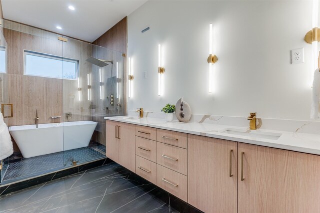 bathroom featuring vanity and independent shower and bath