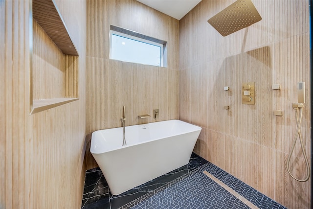 bathroom with shower with separate bathtub