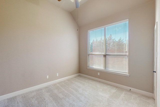 unfurnished room featuring ceiling fan, light carpet, and vaulted ceiling