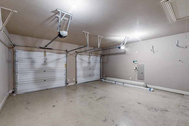 garage with a garage door opener and electric panel