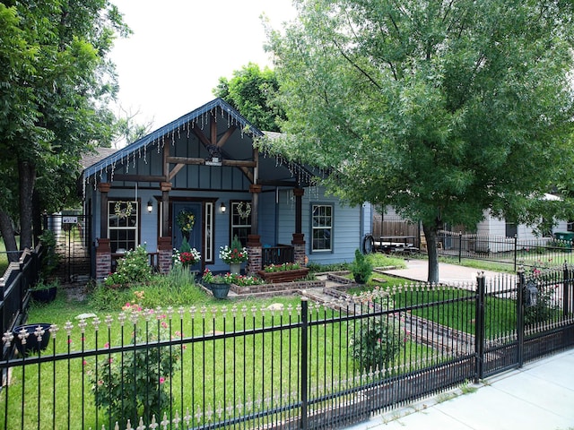 craftsman-style house with covered porch and a front yard