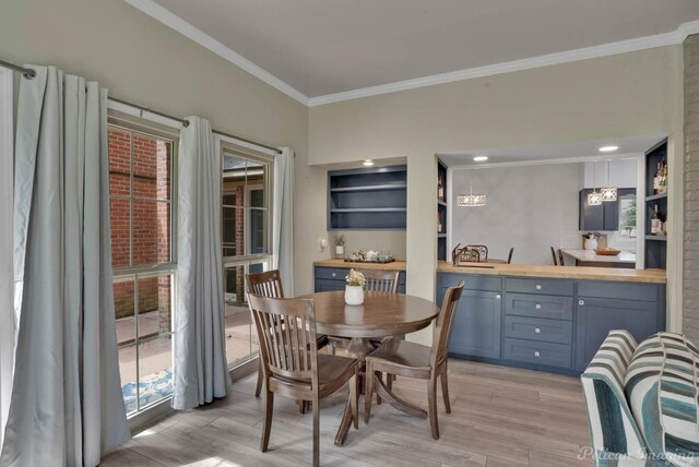 72 Spring Lake Way, Shreveport, LA 71106 - dining room featuring crown molding and light hardwood / wood-style floors