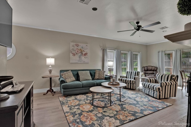 living room featuring crown molding, ceiling fan, and light hardwood / wood-style floors