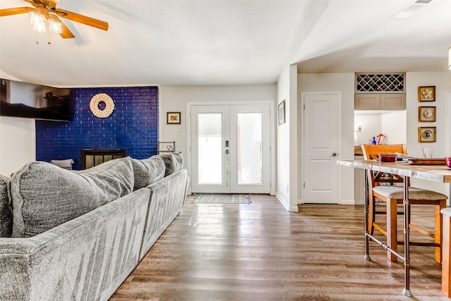 entryway with hardwood / wood-style flooring, ceiling fan, and french doors