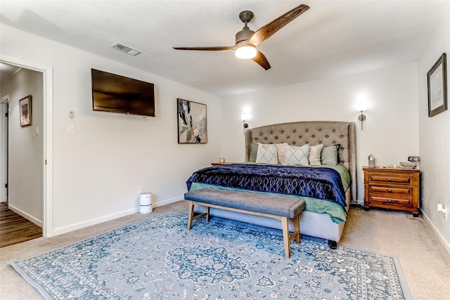 bedroom featuring ceiling fan and carpet