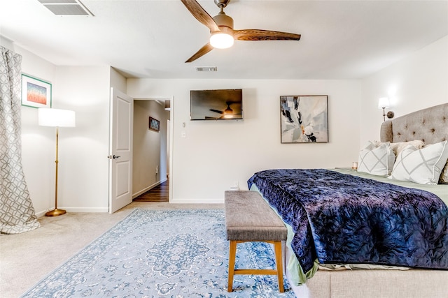 bedroom featuring ceiling fan and light carpet