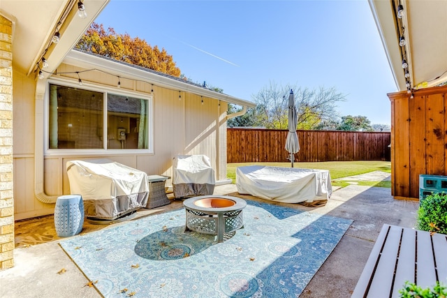 view of patio featuring an outdoor fire pit