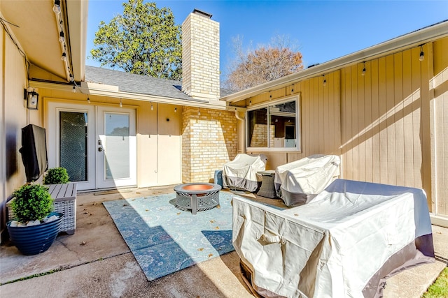 view of patio with grilling area and an outdoor fire pit