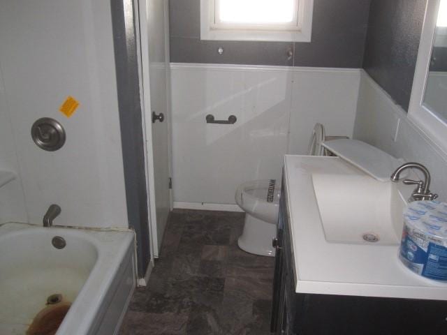 full bathroom featuring vanity, toilet, and tub / shower combination