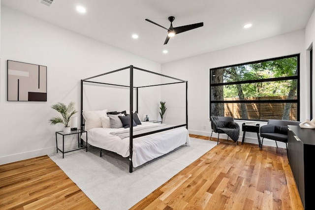 bedroom featuring hardwood / wood-style floors and ceiling fan