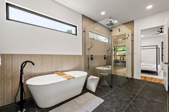 bathroom featuring tile patterned flooring, ceiling fan, and shower with separate bathtub