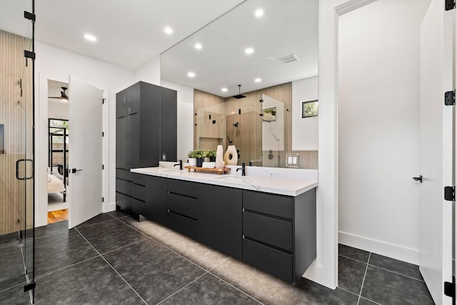 bathroom with vanity, tile patterned floors, and walk in shower