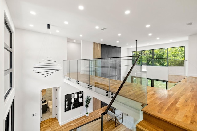 staircase featuring wood-type flooring