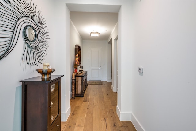 corridor featuring light hardwood / wood-style flooring