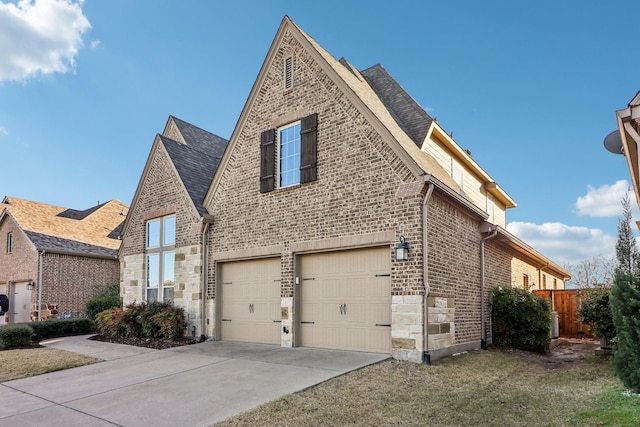 view of side of property featuring a garage