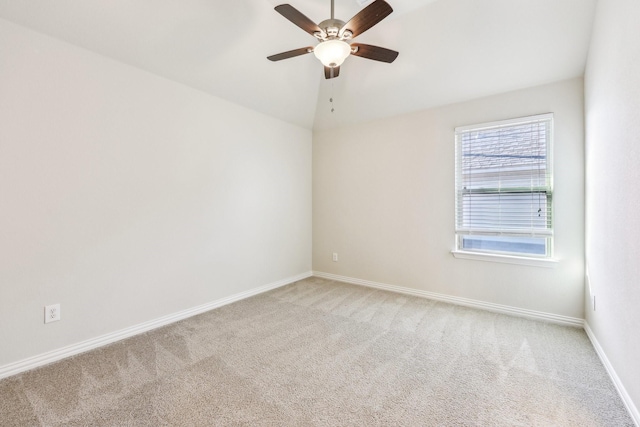 spare room with light carpet and ceiling fan