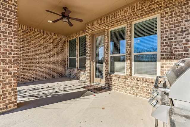 view of patio featuring grilling area and ceiling fan