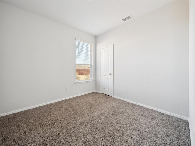 spare room featuring carpet