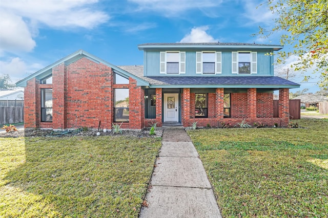 front facade with covered porch and a front lawn