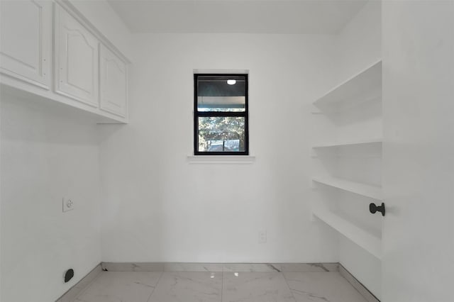 laundry room with cabinets