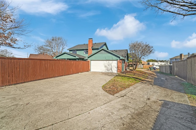 view of property exterior with a garage