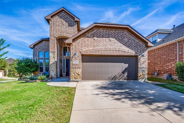 view of front property with a garage and a front lawn