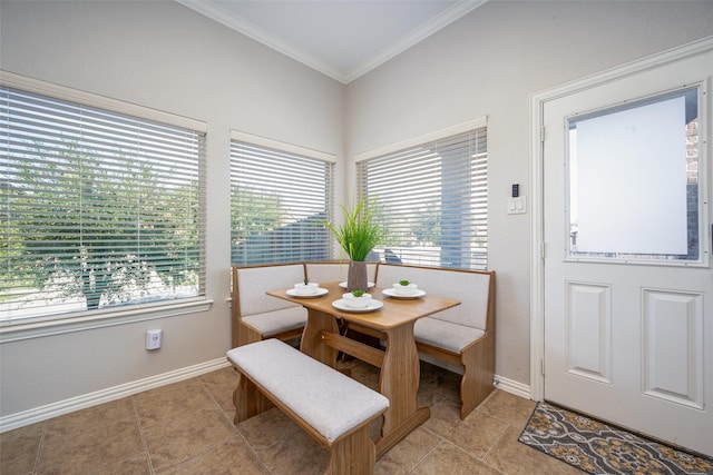 dining room featuring ornamental molding and light tile patterned floors