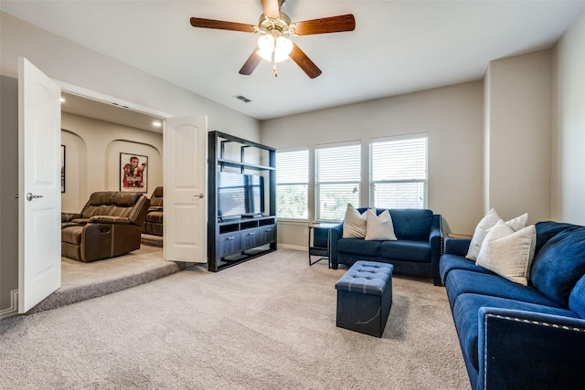 living room with carpet and ceiling fan