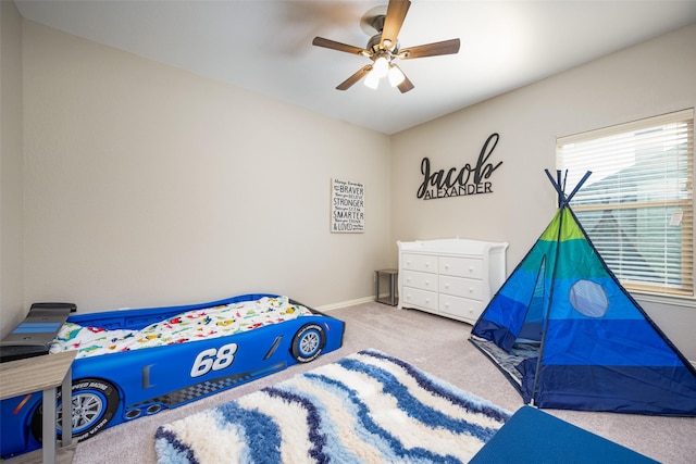 carpeted bedroom with ceiling fan