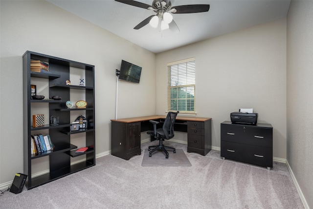 office space with ceiling fan and light carpet