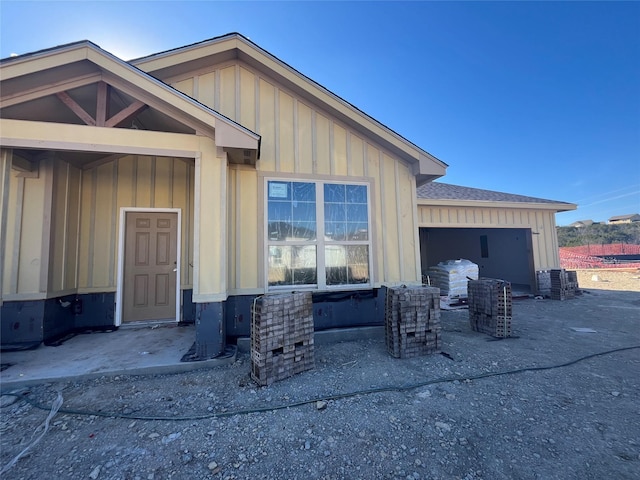 exterior space featuring a garage and central AC unit