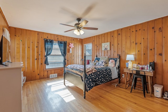 bedroom with ceiling fan and light hardwood / wood-style floors