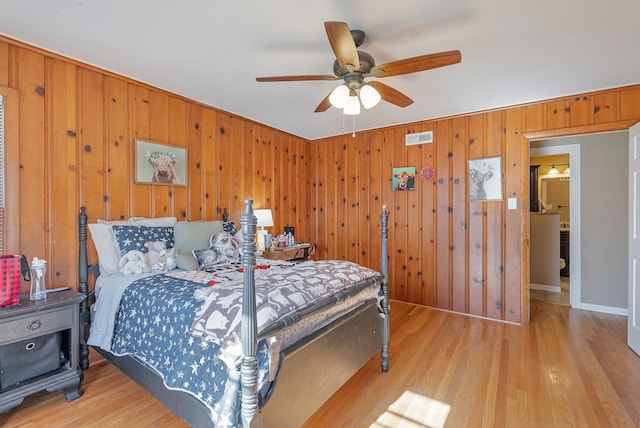 bedroom featuring ceiling fan and light hardwood / wood-style flooring