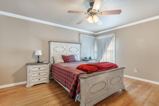 bedroom featuring ceiling fan, ornamental molding, and light hardwood / wood-style flooring