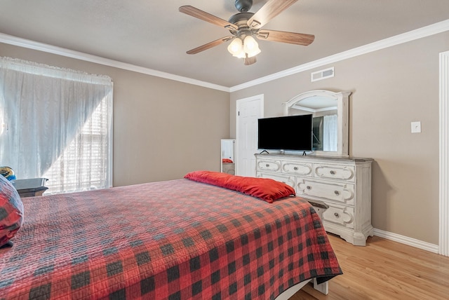 bedroom with ceiling fan, ornamental molding, and light hardwood / wood-style flooring