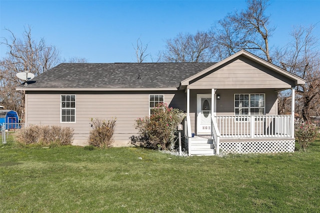 single story home featuring covered porch and a front lawn