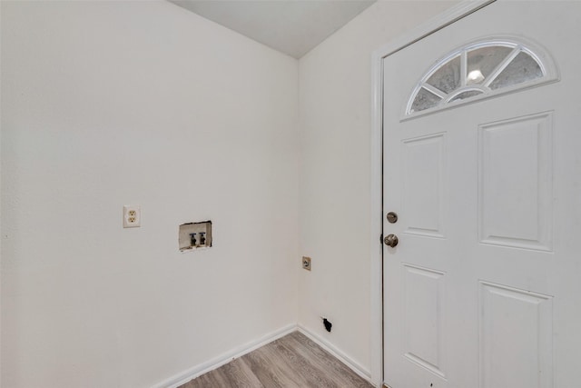 laundry room with washer hookup, electric dryer hookup, and light wood-type flooring