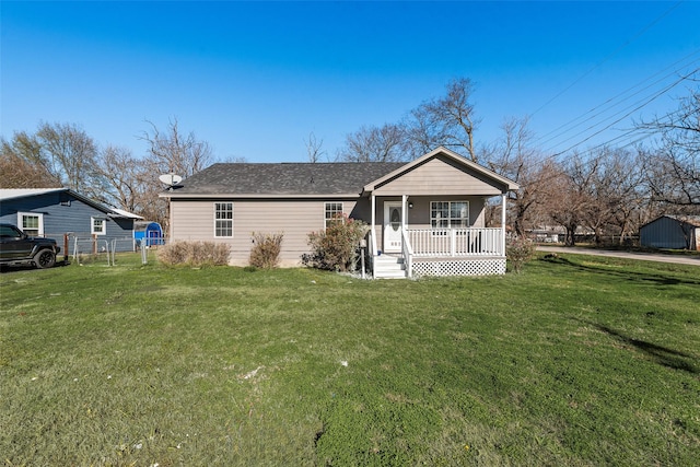 ranch-style home featuring a front yard and a porch