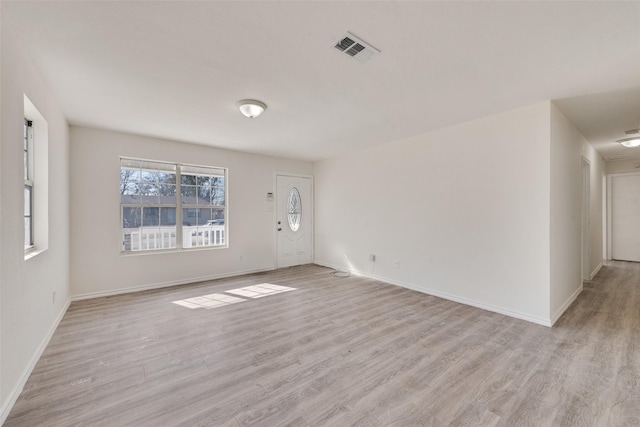 unfurnished room featuring light hardwood / wood-style flooring