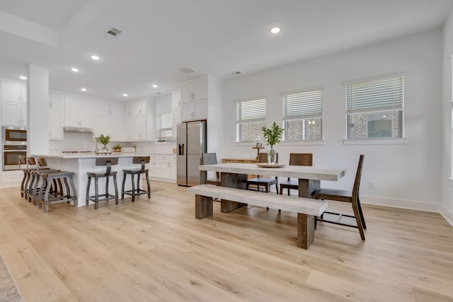 dining room with light hardwood / wood-style floors