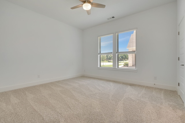 unfurnished room featuring ceiling fan and carpet